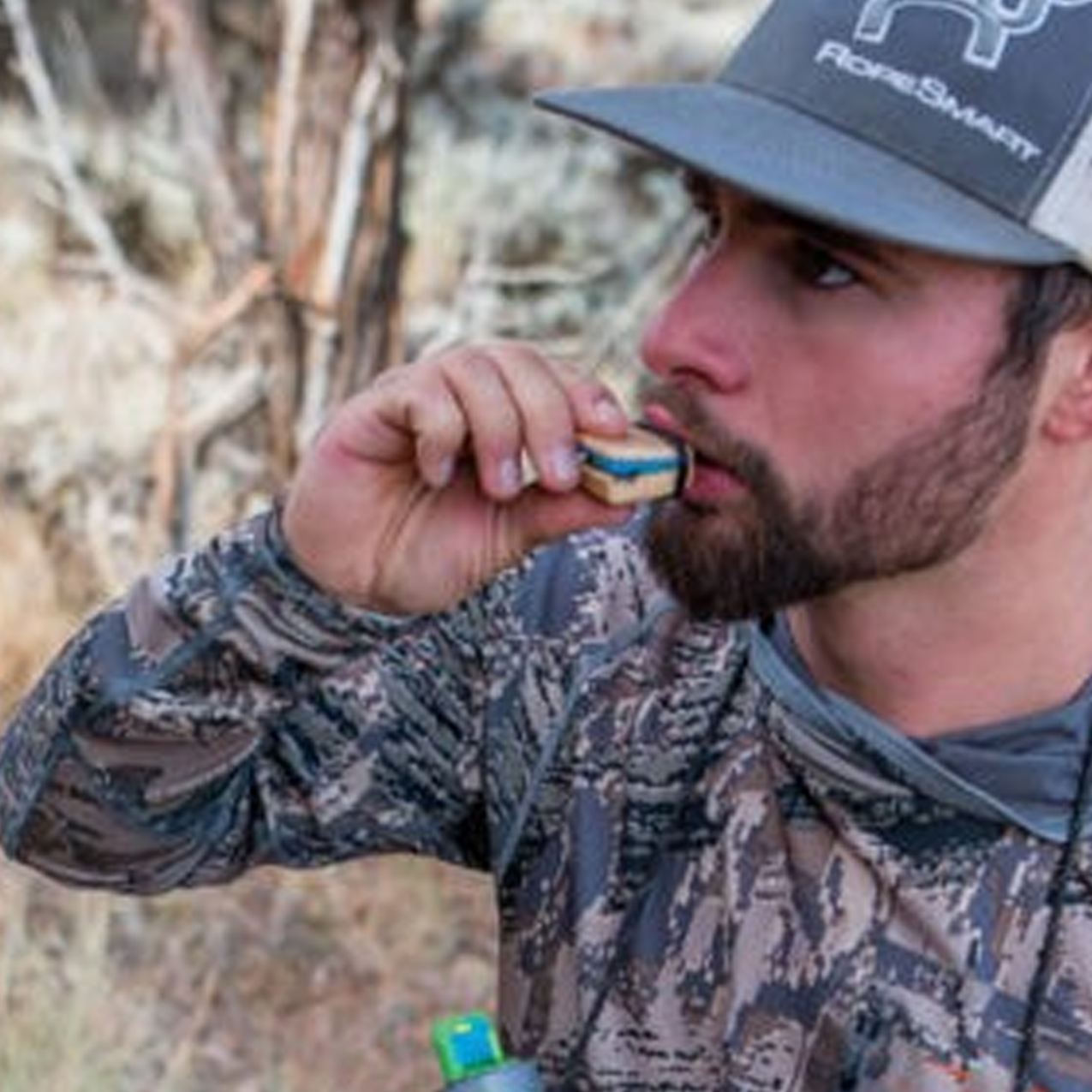A hunter using the Elk Reel classic call hardwood with his hands