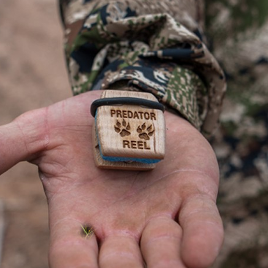 Photo of Predator Reel in a hunter's palm