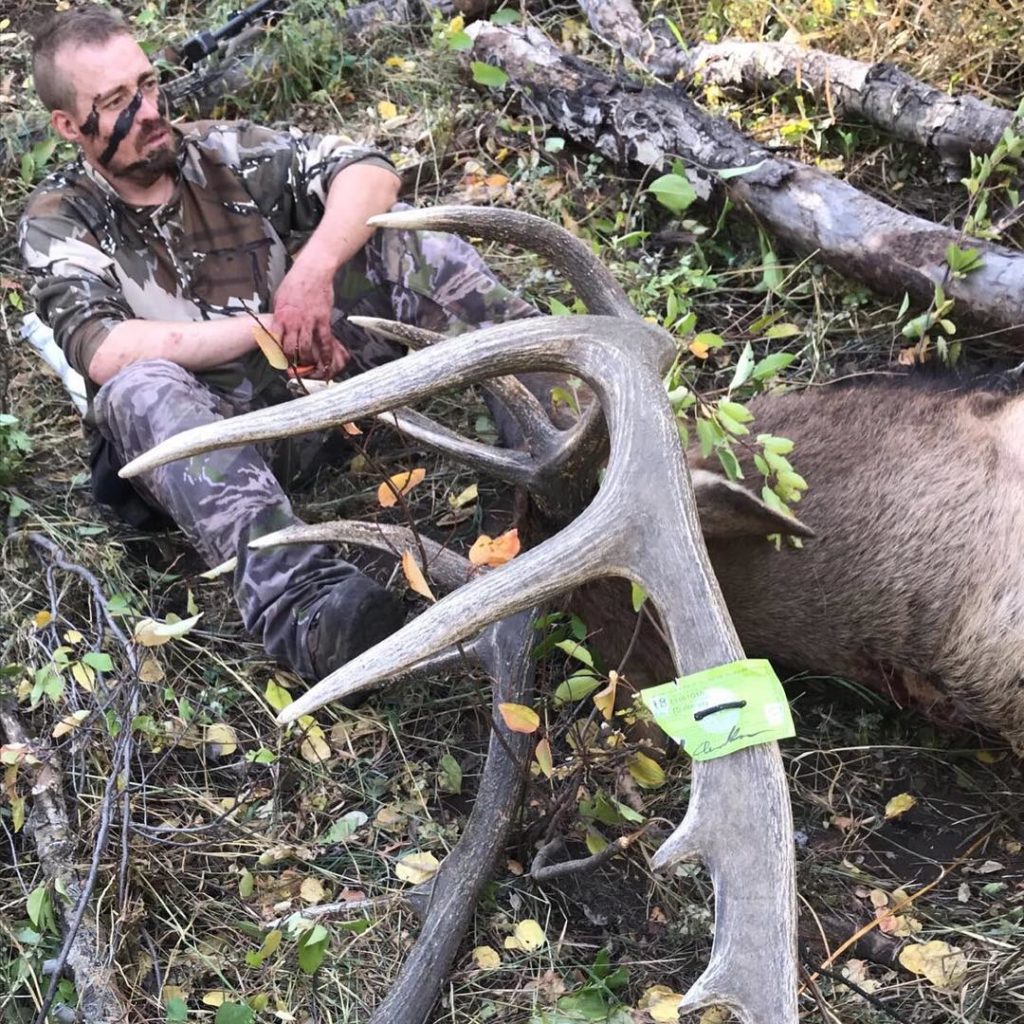 Owner Drew Rouse with huge bull elk